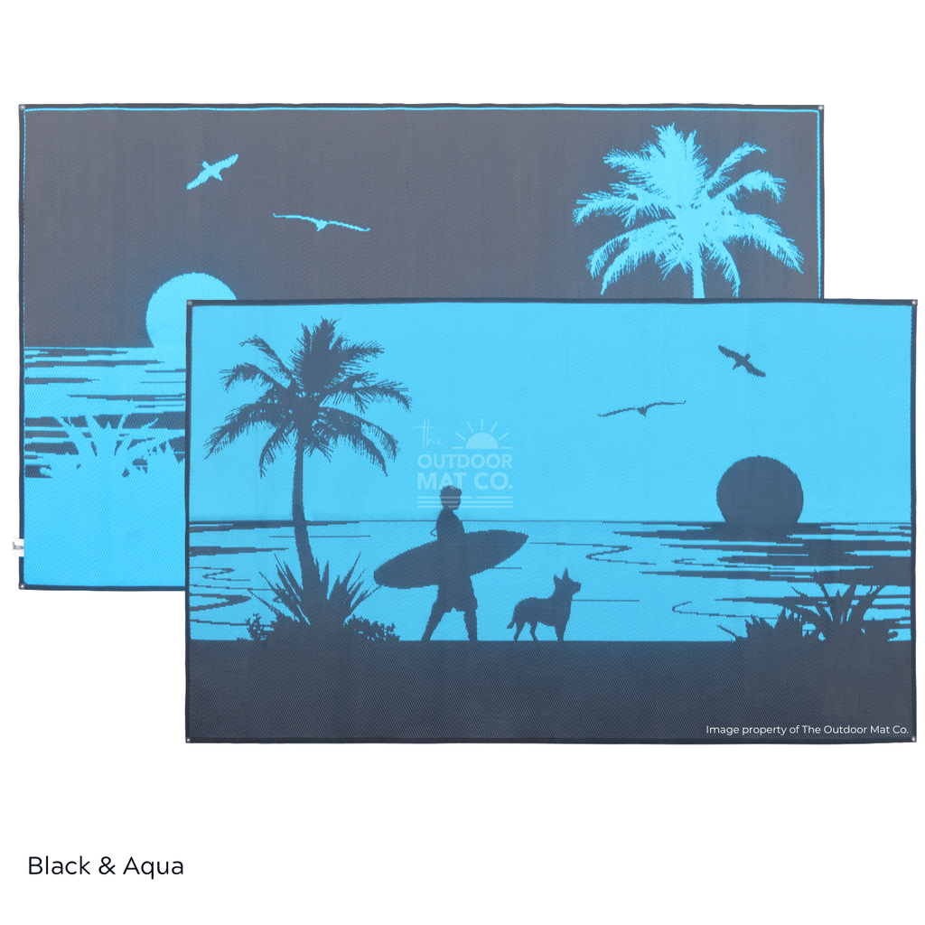 Black and aqua recycled outdoor mat with beach sunset, palm tree, surfer, and dog silhouettes for camping or picnics