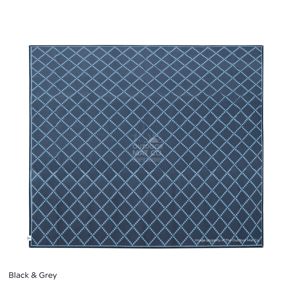 Black and grey recycled outdoor mat with diamond pattern, ideal for beach, camping, picnics, and caravans