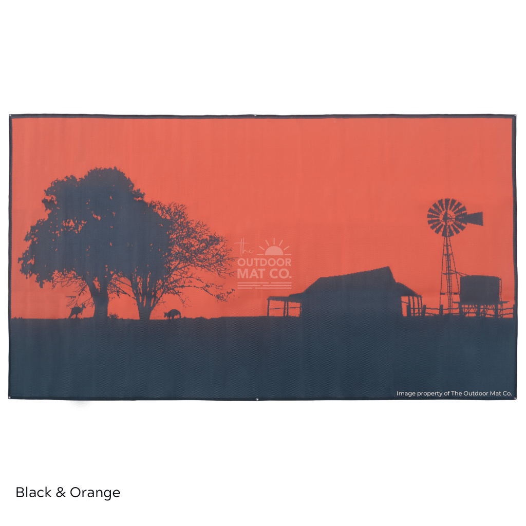 Black and orange recycled outdoor mat with farm silhouette, perfect for camping, beach, or picnics