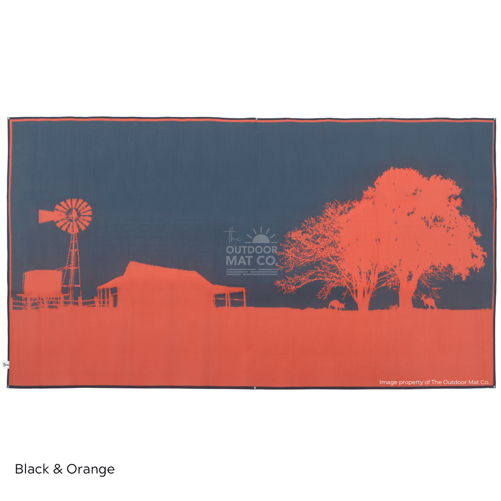 Black and orange recycled outdoor mat with farm silhouette, perfect for camping, beach, or picnics