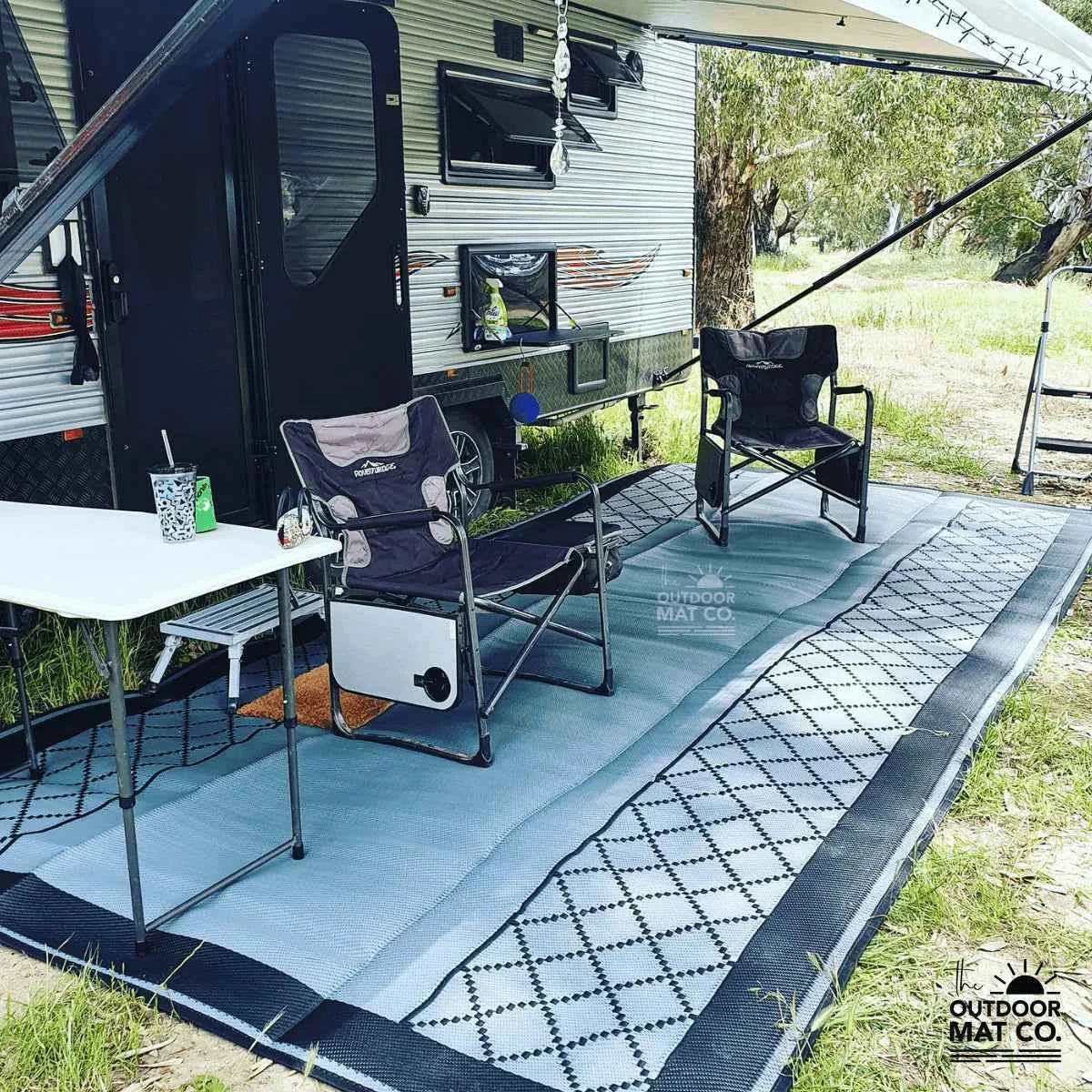 Recycled outdoor mat for caravan camping, featuring geometric pattern, durable design, and grass-friendly surface.