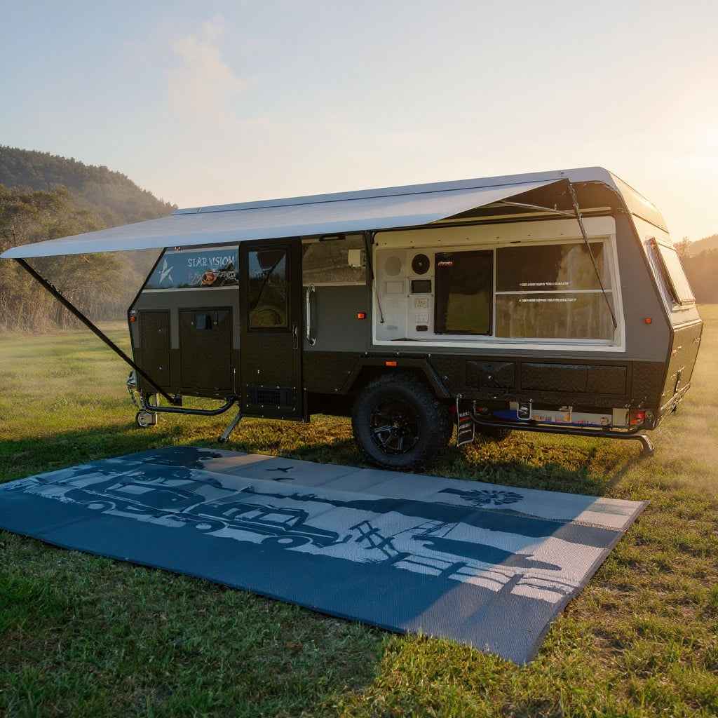 Recycled outdoor mat with caravan graphic, perfect for camping, picnics, and beach days on grassy terrain.