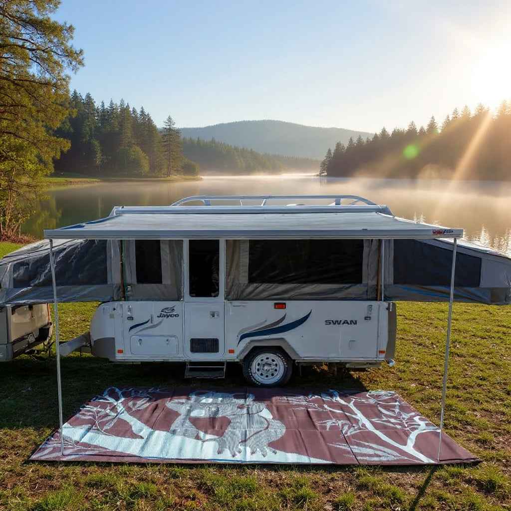 Eco-friendly recycled outdoor mat under caravan by lake, perfect for camping and picnics