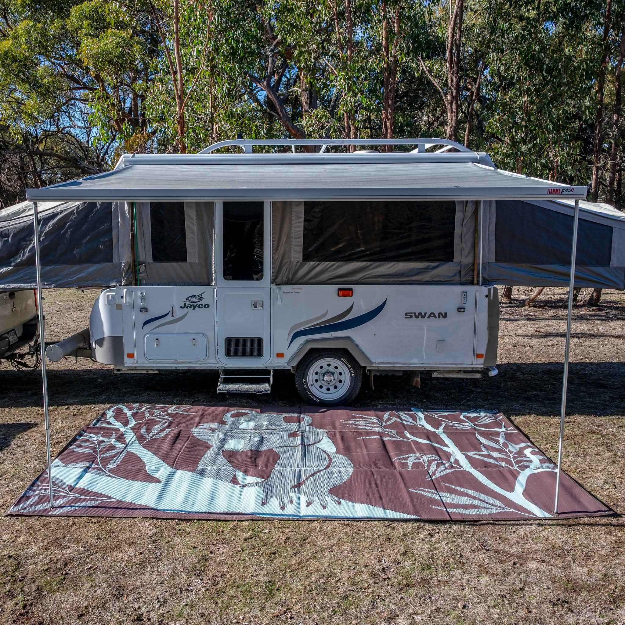 Eco-friendly outdoor mat with koala design under caravan awning, perfect for camping and picnics