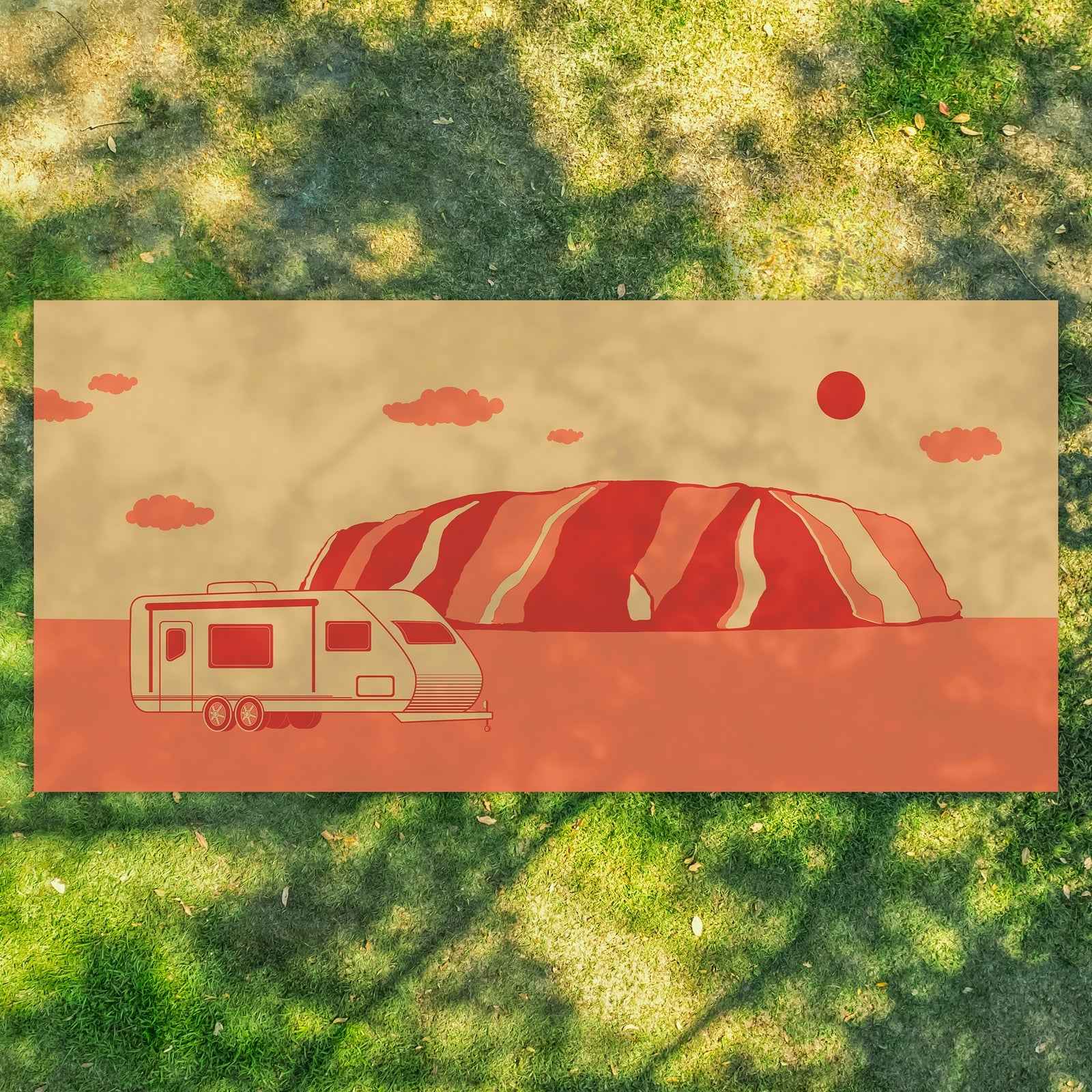 Recycled outdoor mat with caravan and Uluru design, perfect for camping, picnics, or beach days on grass.