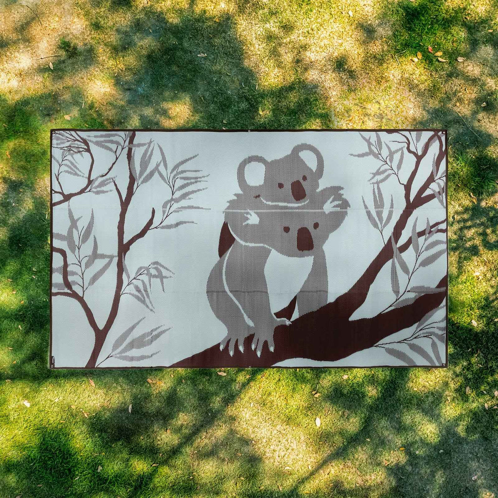 Koala print recycled outdoor mat on grass, perfect for picnics, camping, beach days