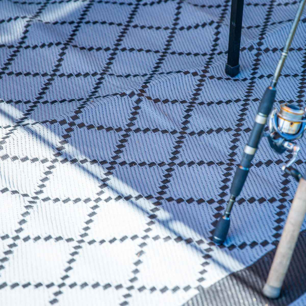 Recycled outdoor mat with geometric pattern, ideal for beach, camping, or fishing trips