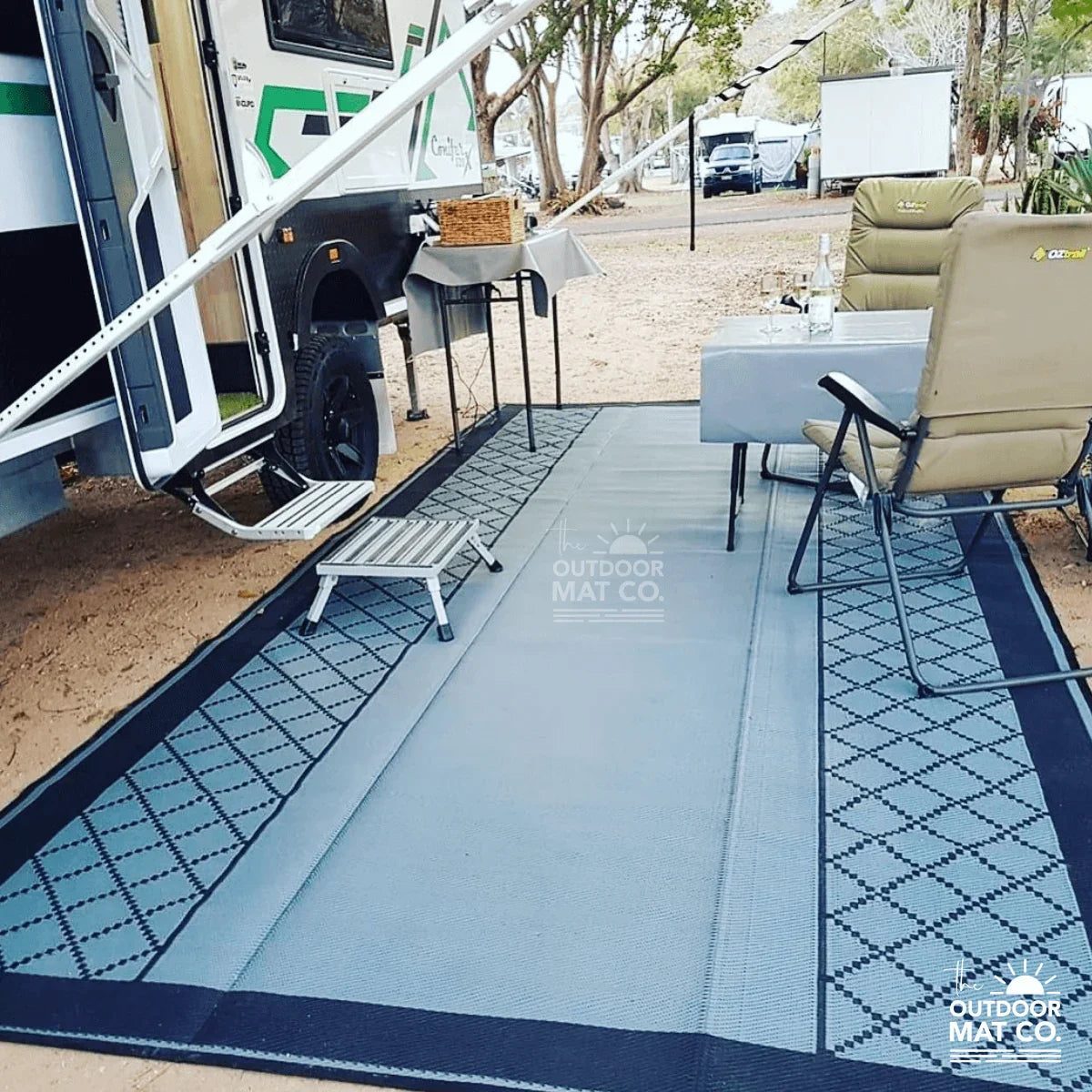 Recycled outdoor mat for caravan camping, featuring durable design with geometric pattern, perfect for sand and grass.