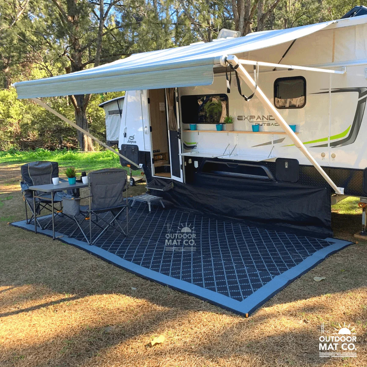 Recycled outdoor mat under caravan awning, perfect for camping and picnics on grass or sand