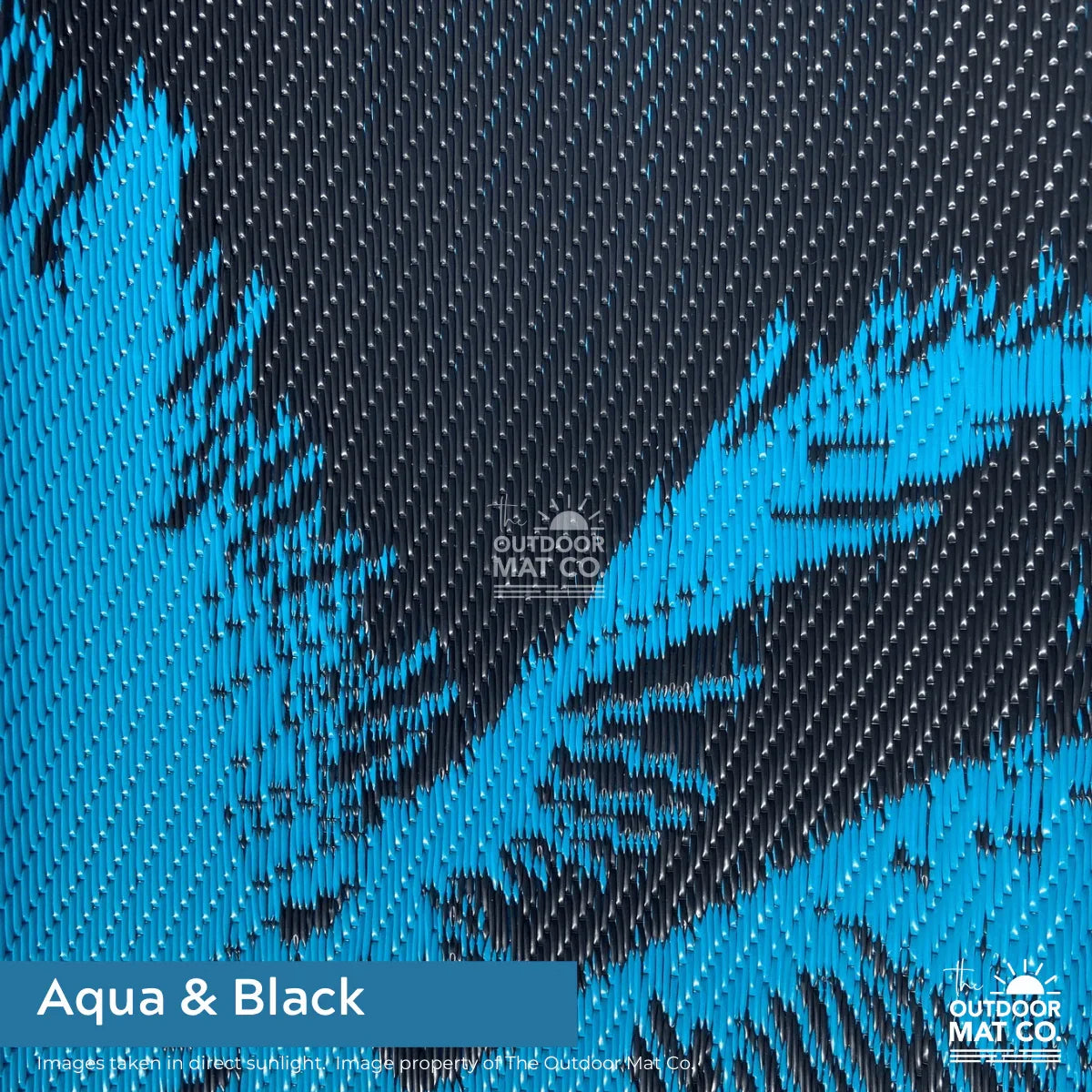 Aqua and black recycled outdoor mat with textured pattern, ideal for beach, camping, picnics, and caravans.