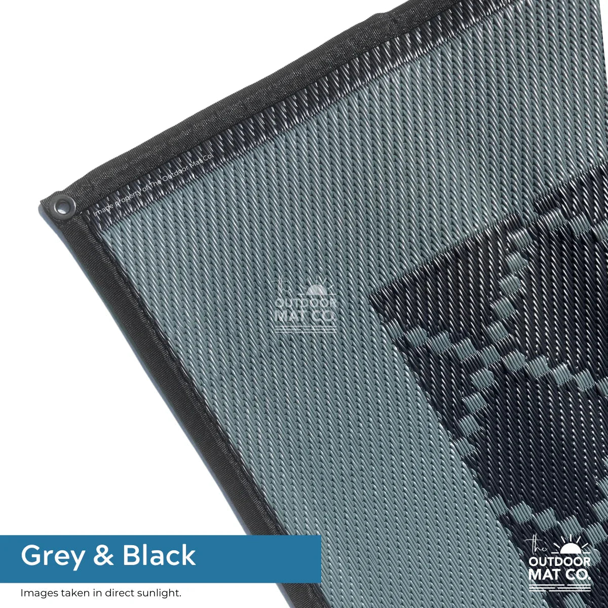 Grey and black recycled outdoor mat with textured weave, ideal for beach, camping, or picnics.