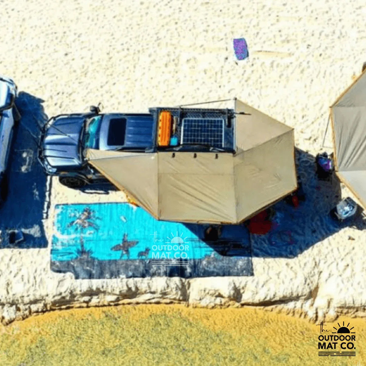 Blue recycled outdoor mat under 4wd awning at beach, perfect for camping & picnics