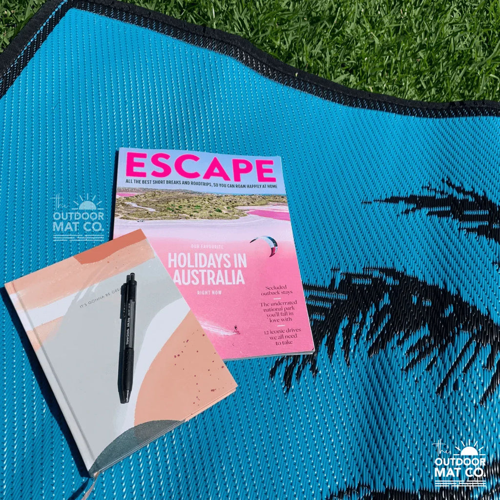 Blue recycled outdoor mat with palm print, perfect for picnics, beach days, and camping adventures.