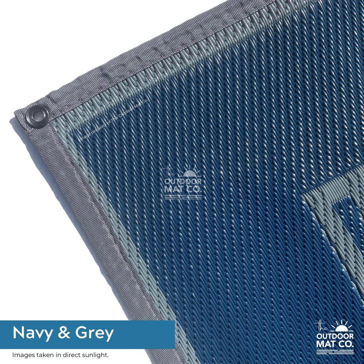 Navy & grey recycled outdoor mat with durable woven texture, ideal for beach, camping, picnics, and caravans.