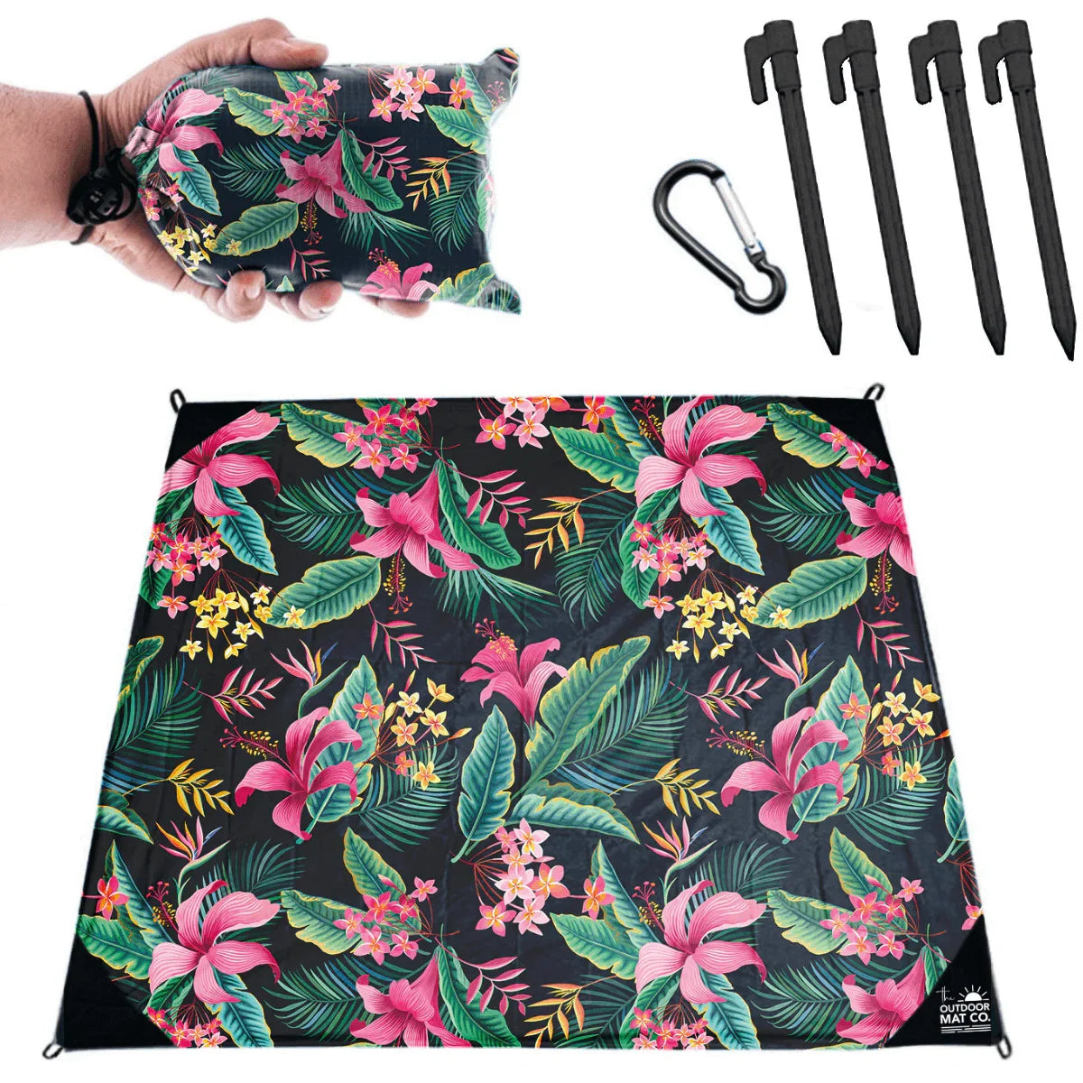 Tropical floral outdoor mat with pink flowers, green leaves, stakes, and carabiner for beach, camping, picnics